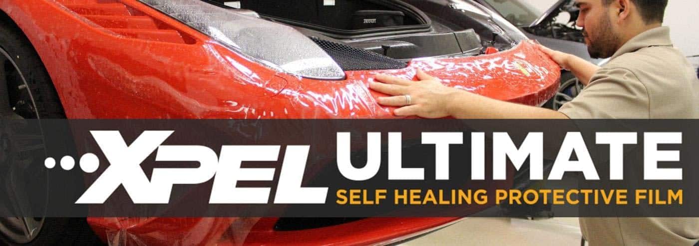 xpel_ultimate_banner XPEL Ultimate Plus Car Paint Protection Film getting installed on Ferrari front end.