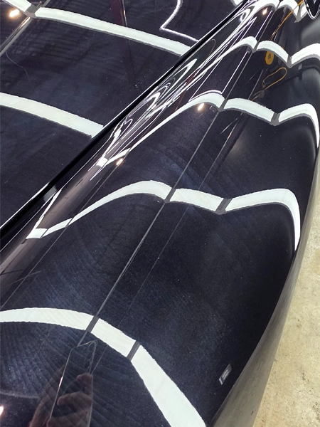 Old PPF adhesive residue visible on Porsche 911 fender